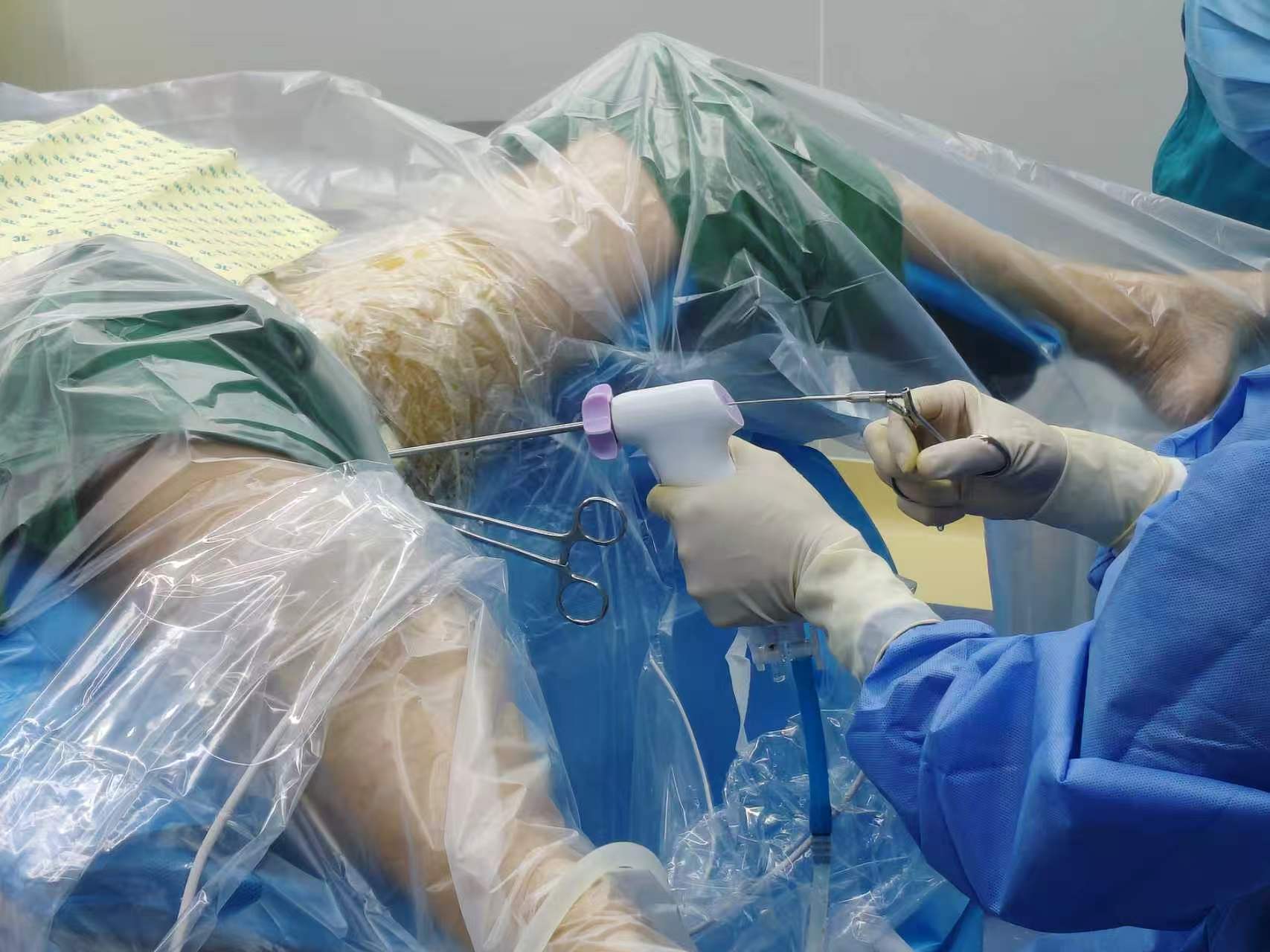 Clinician using an endoscopic instrument during a procedure